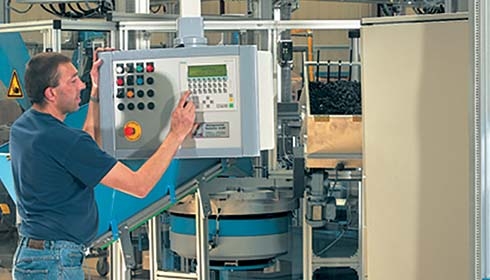 A person operating a machine