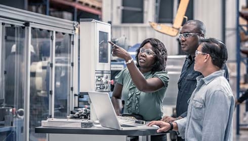 A group of people in a factory
