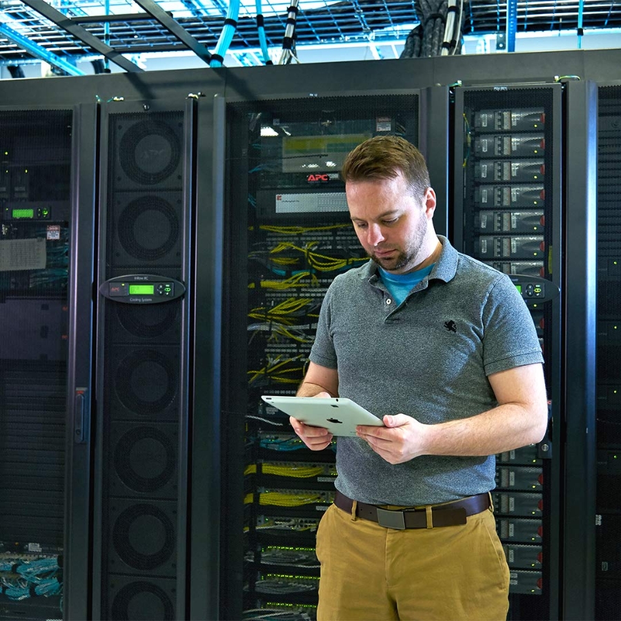 Man standing with Tablet at data center