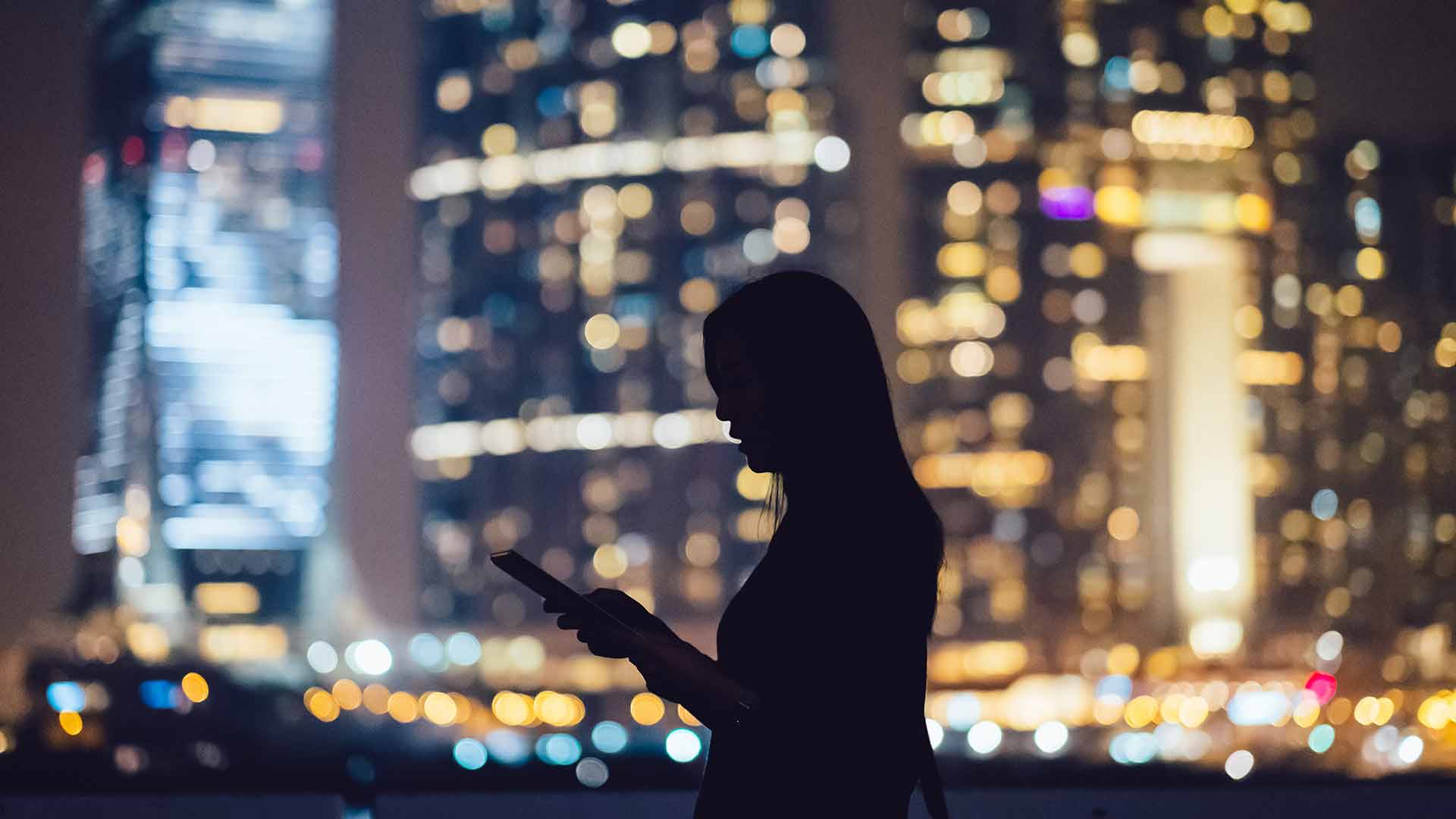 woman using mobile in a smart city