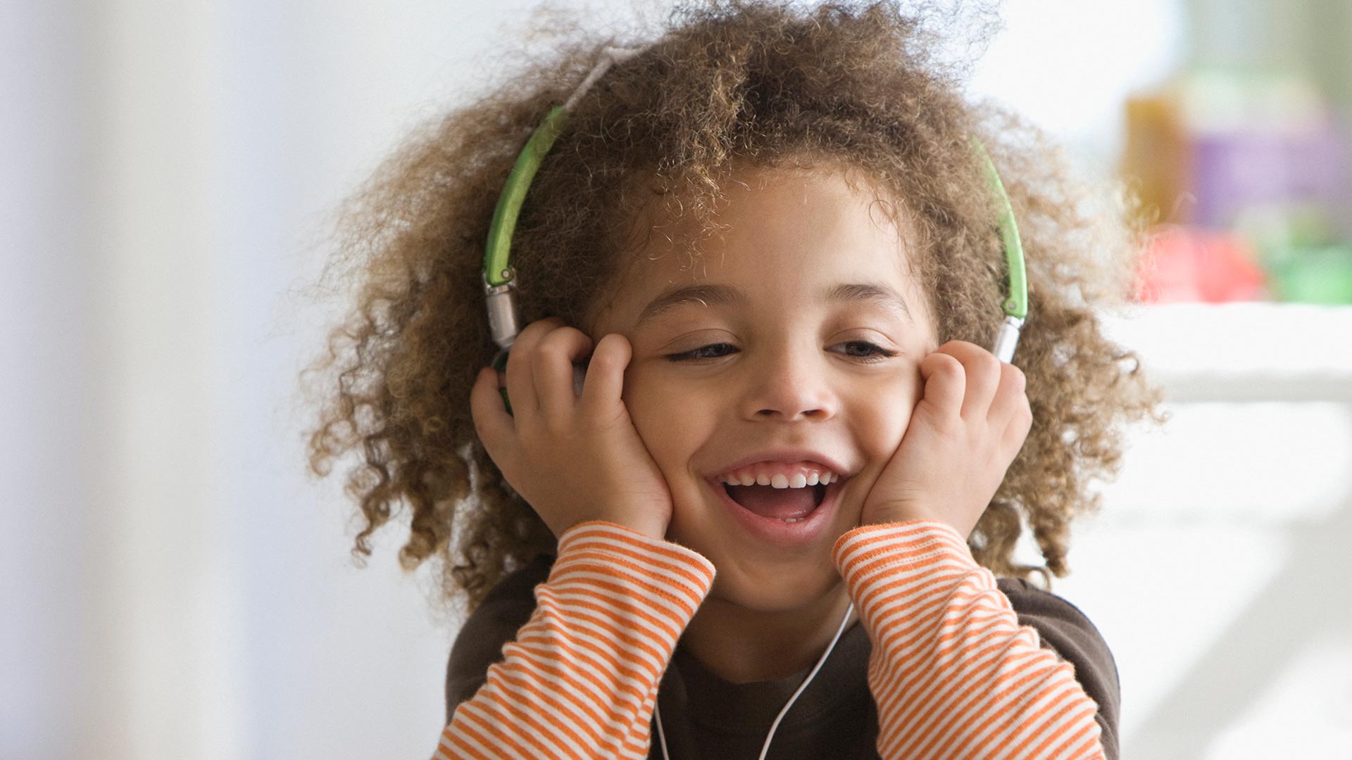 happy kid listening to podcast