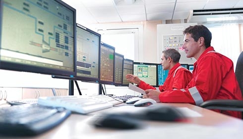 Employees working inside a control center