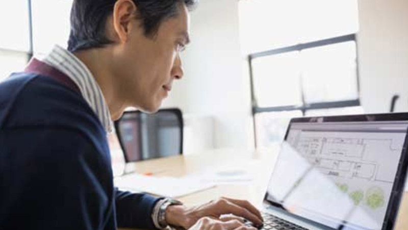 man working at computer screen
