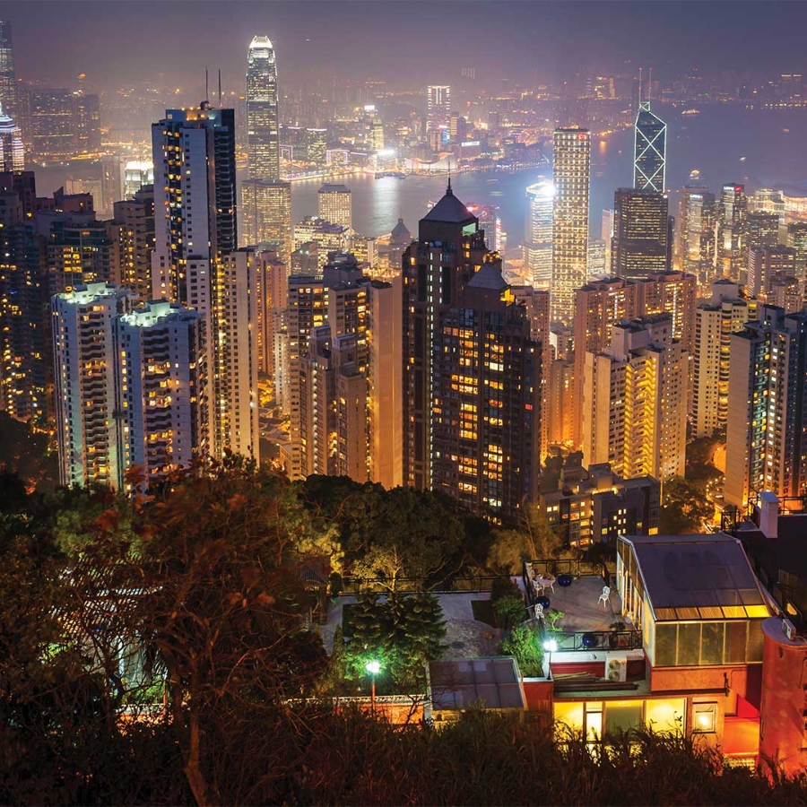 Cityscape at night displaying buildings powered by smart grid solutions.