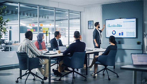 A group of people sitting around a table