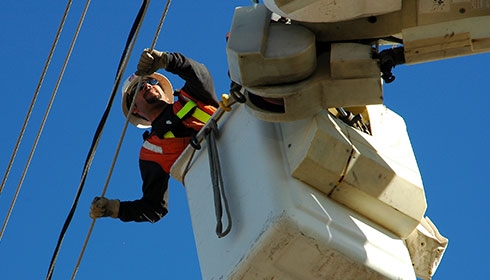An electrician working on grids