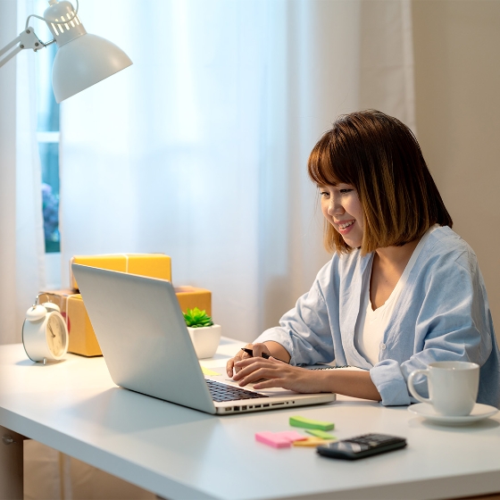 Girl using laptop in work area