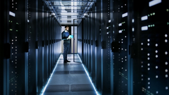 man with tablet in datacenter