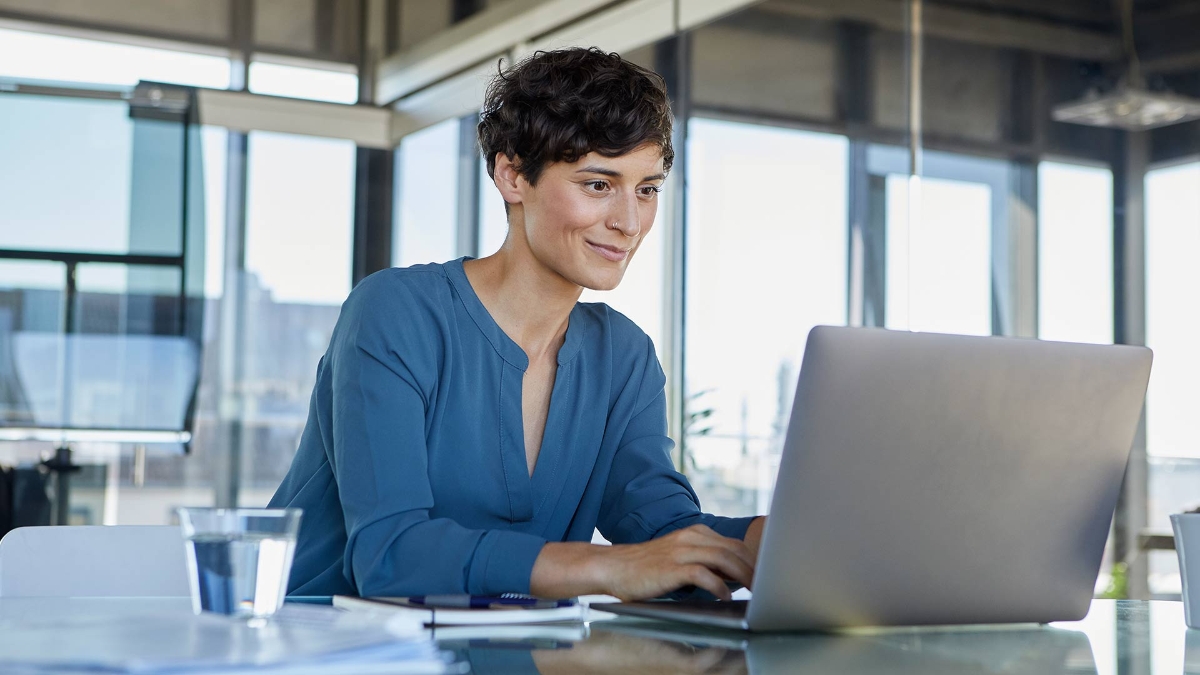 A businesswoman working on her laptop in office
