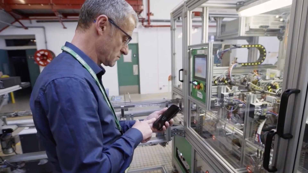 A person using mobile phone in Electric office 