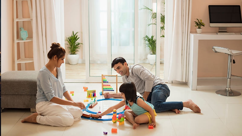 Family is enjoying and playing game in living room