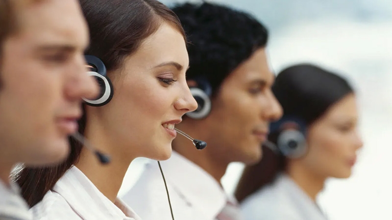 A group of people with headsets priority support program