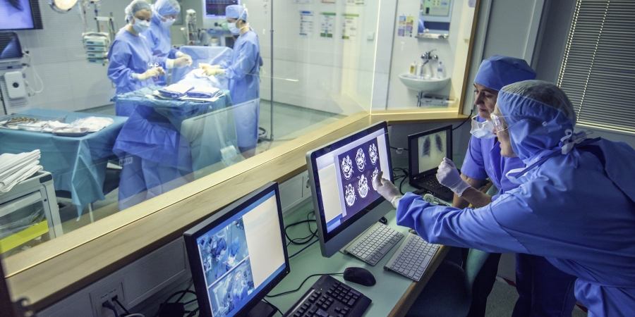 doctors watching computer screen in operation theater