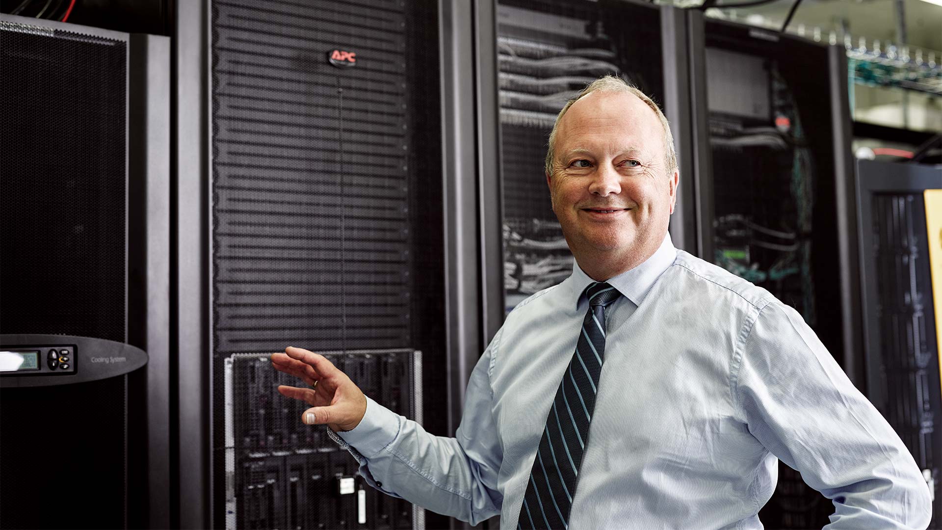 man standing in front of datacenter