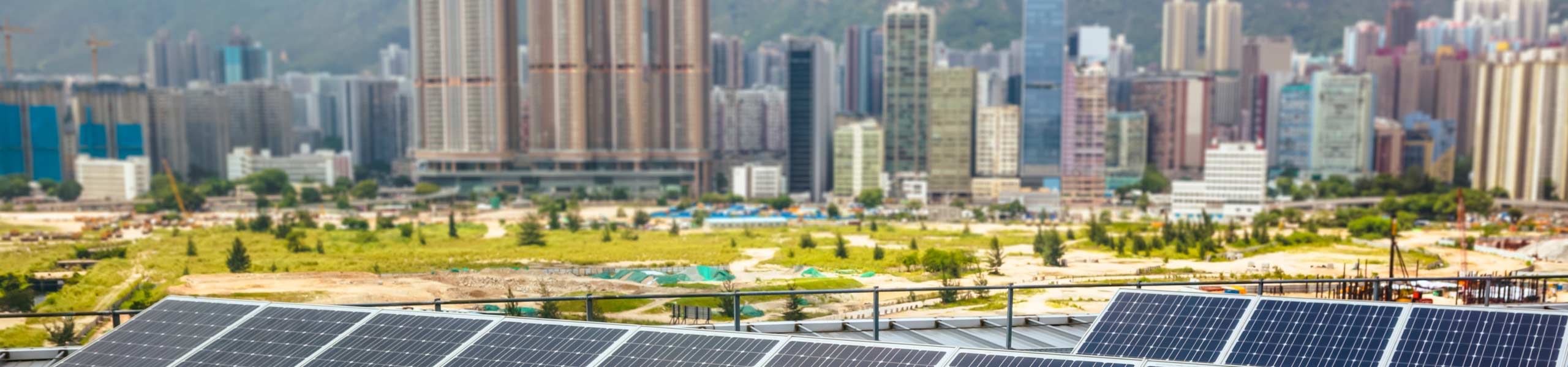 Solar Panels with a modern city background