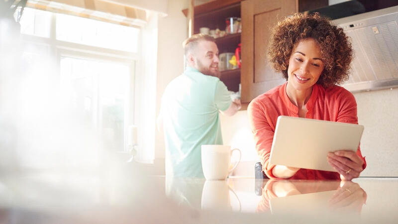 A girl is checking her tablet