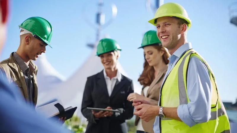 A group of people wearing hard hats