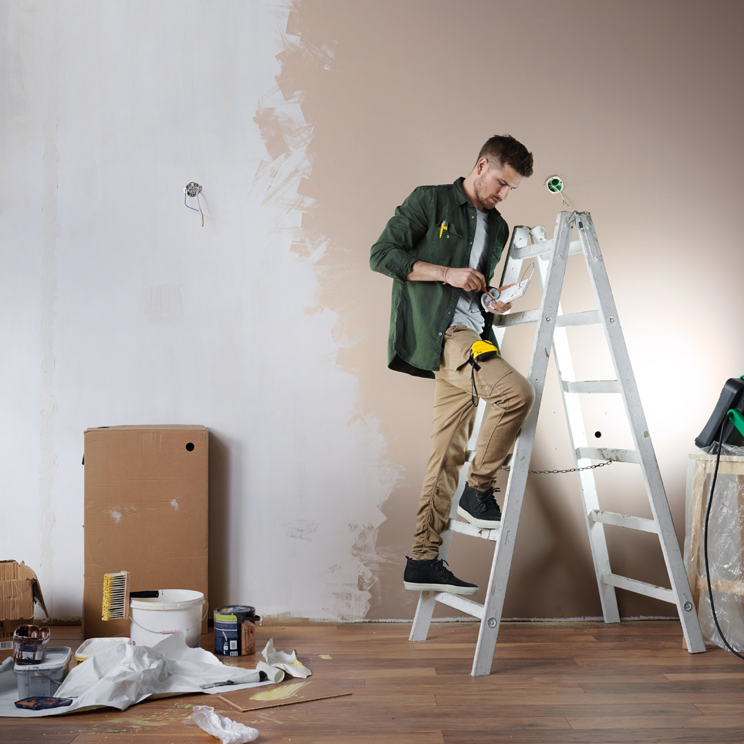 Man Painting a wall