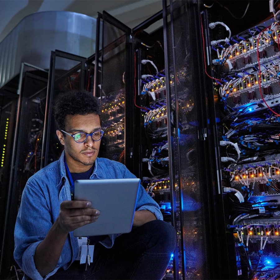 man using tablet in data center