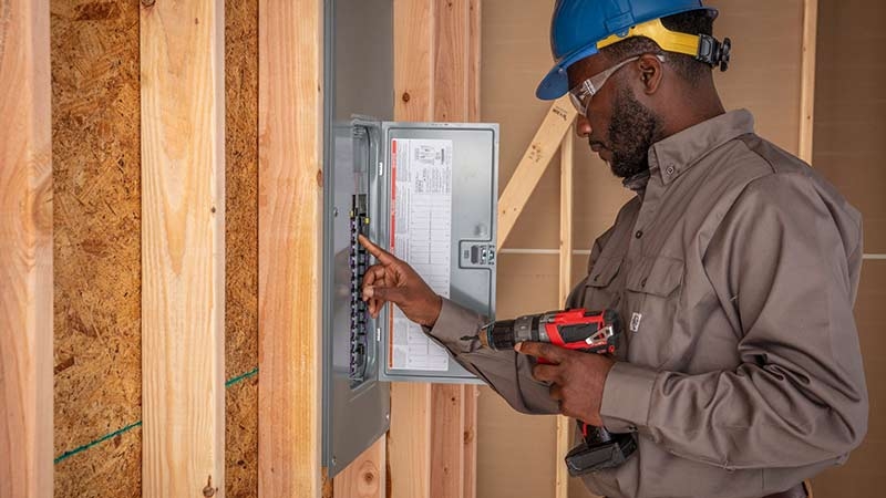 Electrician fixing a board