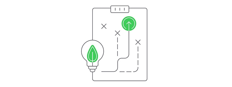 A light bulb and green arrows