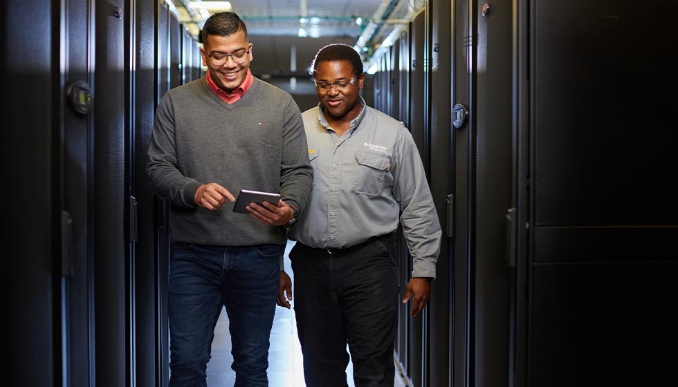 two person walking near super computers