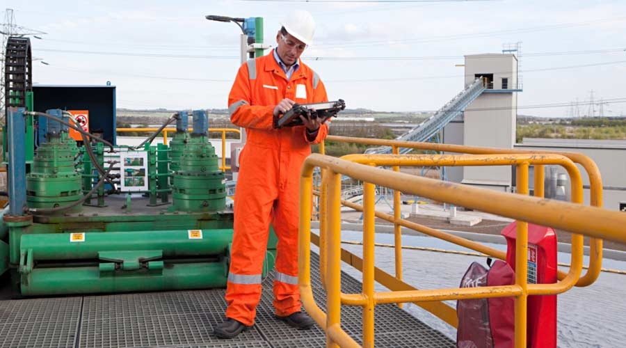 Engineer using handheld computer