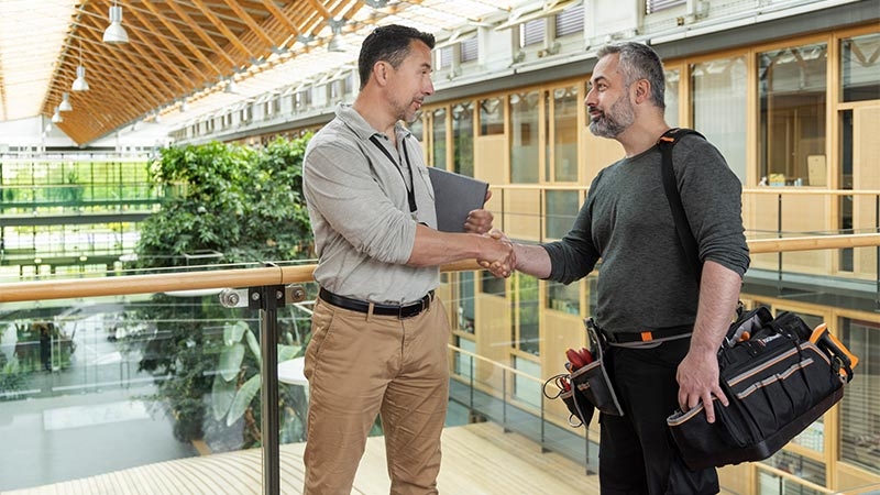 A person shaking hands with another person