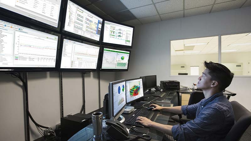 Services technician working in the control room
