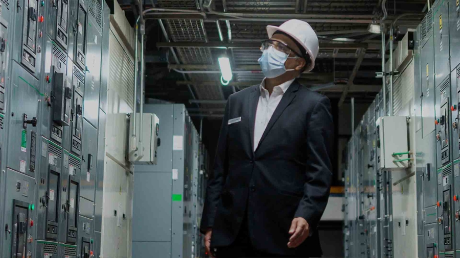 man with hardhat in datacenter