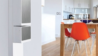 A kitchen with a table and a refrigerator