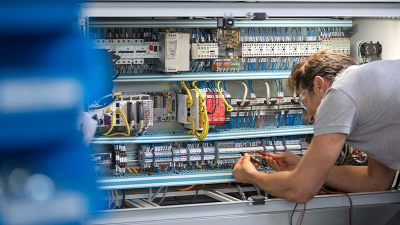 A person working on a machine