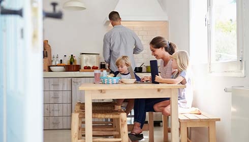 A person and children sitting at a table