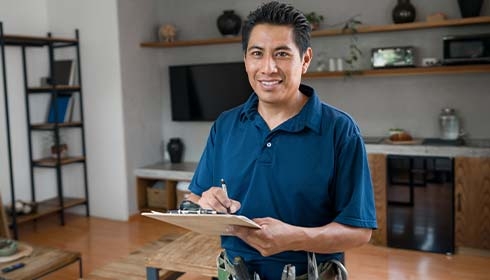 A person holding a clipboard and pen