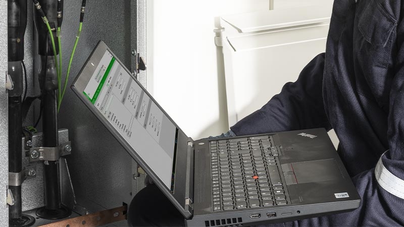 A person sitting at a desk with a computer