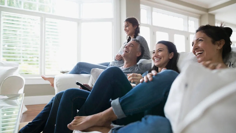 A group of people sitting on a couch