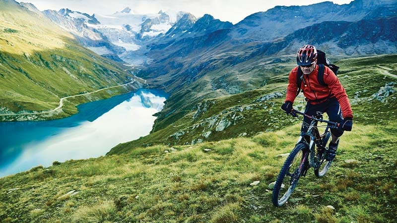 A person riding a bike on a mountain