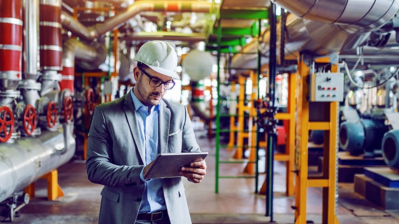 A man working on tablet in industry