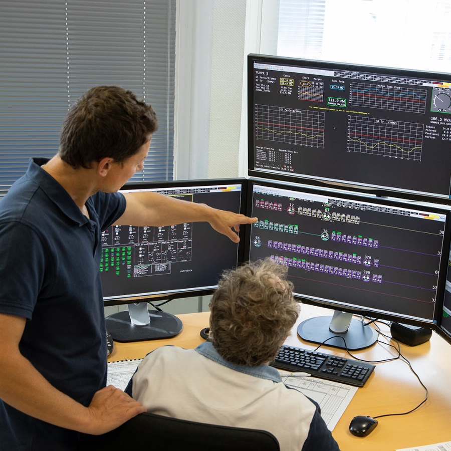 Two person in a Control Room