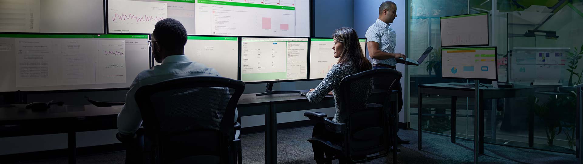 A group of people sitting at a desk