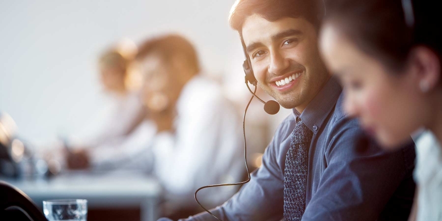 A customer service representative smiling