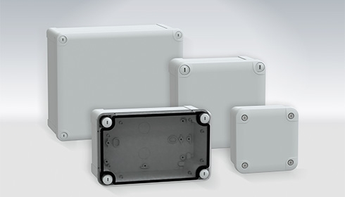 Several rectangular boxes with black plastic cover