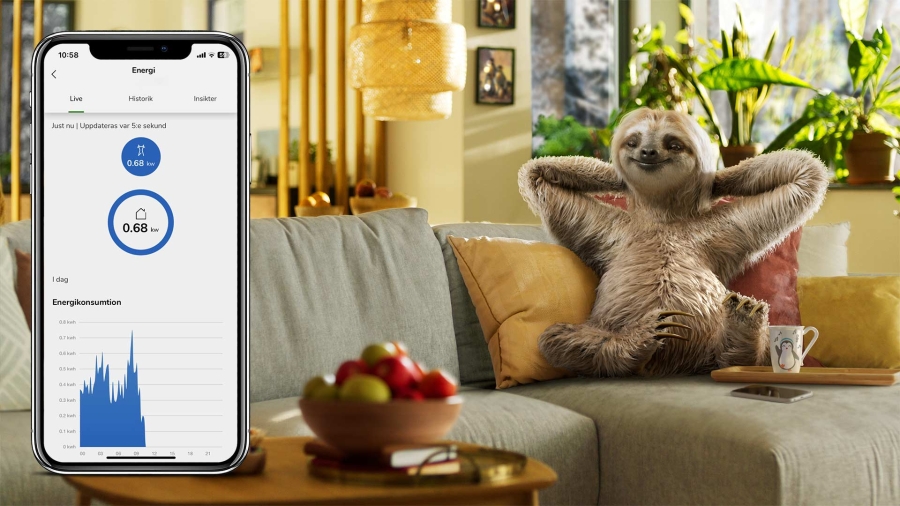 Sloth sitting on couch with montage of mobile app screen shot Energy center