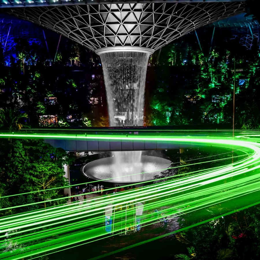 Inside view of Singapore Airport with a trail of green light