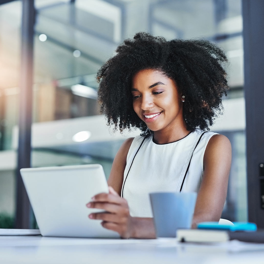 Woman smiling at a laptop