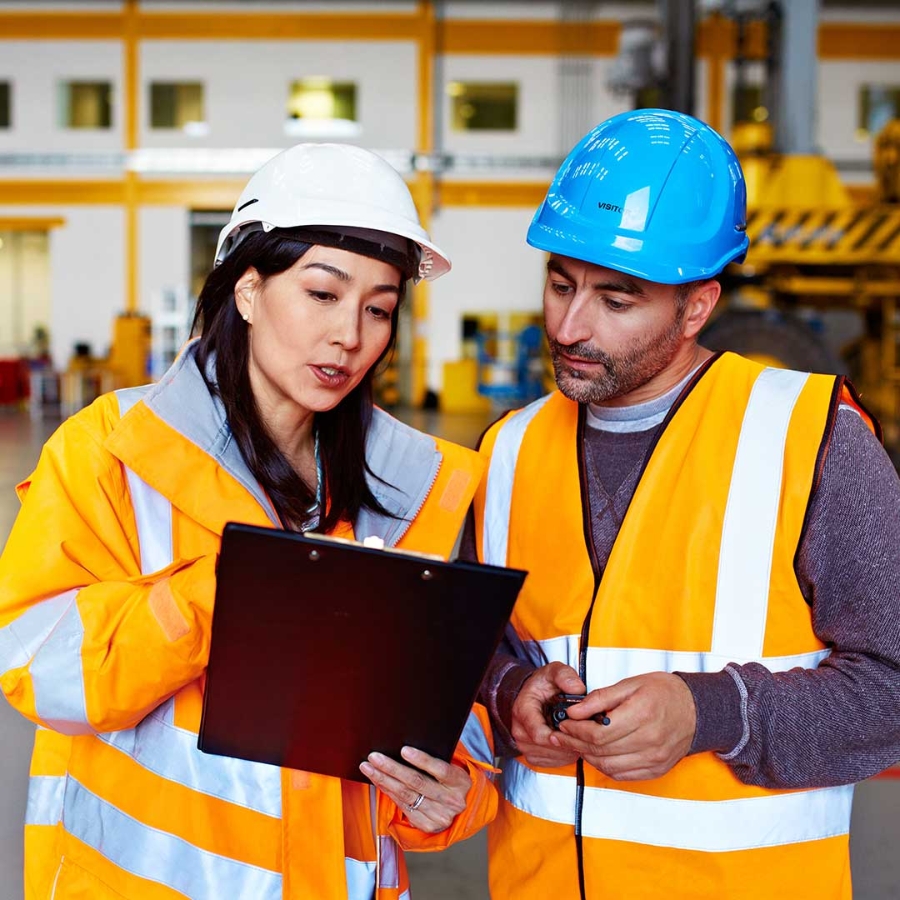 People talking in a factory