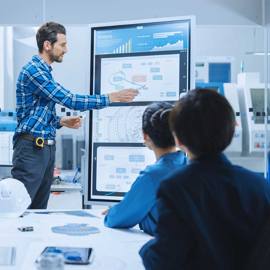 Man pointing at a white board