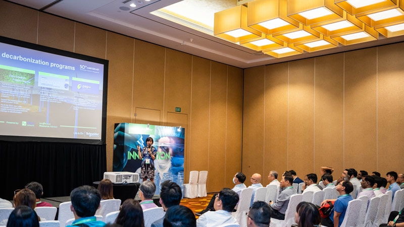Speaker onstage delivering strategy talk