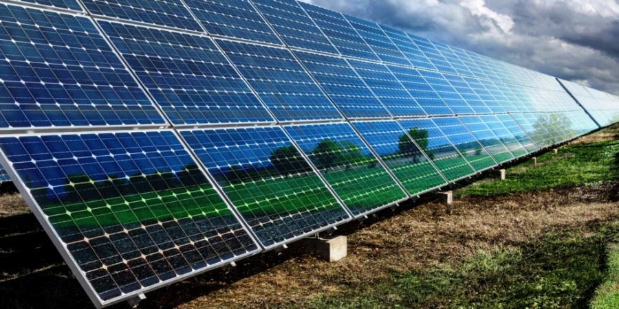 Blue solar panels and cloudy sky