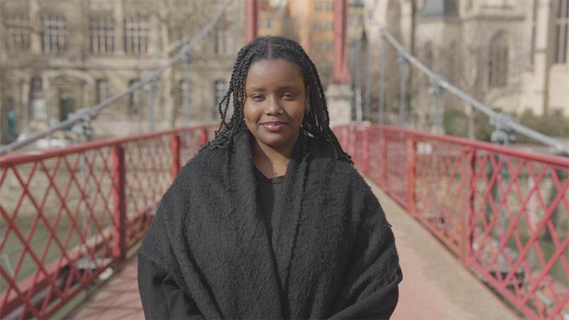 A person standing on a bridge